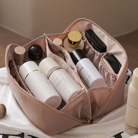 Women's stylish makeup bag and cosmetic organizer, designed for travel and beauty essential storage.