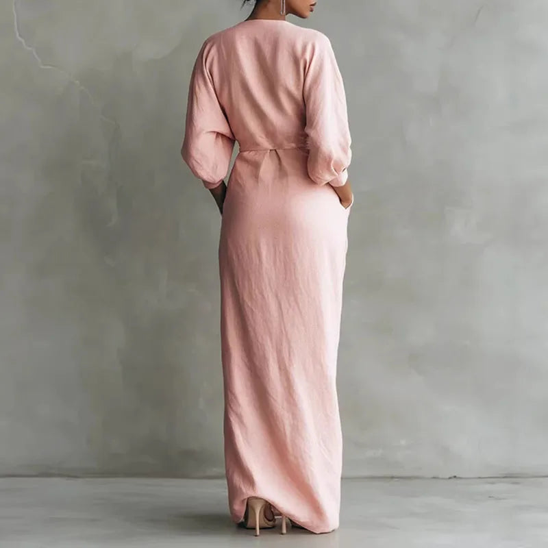 Women's black V-neck wrap maxi dress with long sleeves, ideal for formal events.