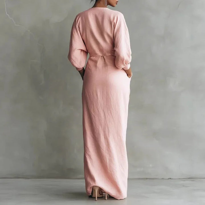 Women's black V-neck wrap maxi dress with long sleeves, ideal for formal events.