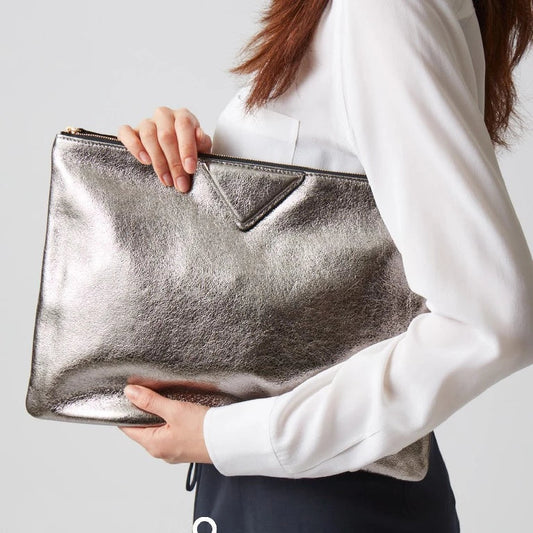 Elegant pink vegan leather shoulder bag for women, featuring a secure interior pocket & gold accents.