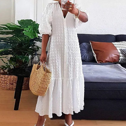 Flattering plus size maxi dress for women, featuring a stylish V-neck and comfortable fabric. All-year versatile.