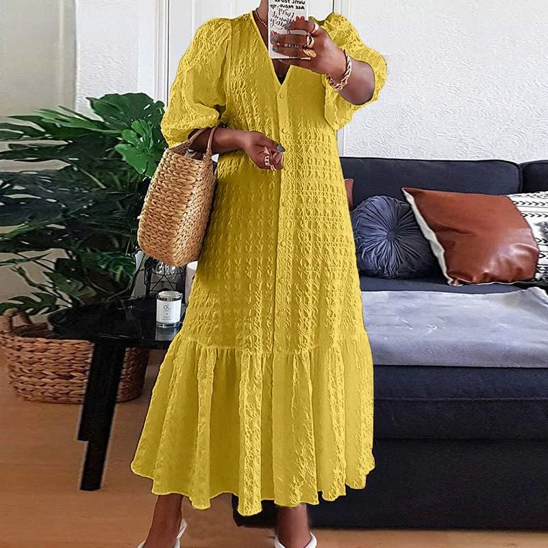 Beautiful plus size V-neck maxi dress with elegant design & puff sleeves. Perfect for a confident look.