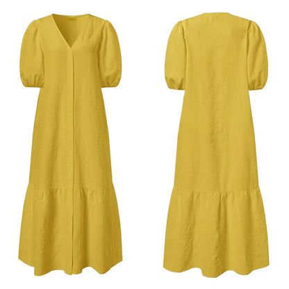 V-neck plus size women's maxi dress with sophisticated button details. Versatile for casual or formal wear.