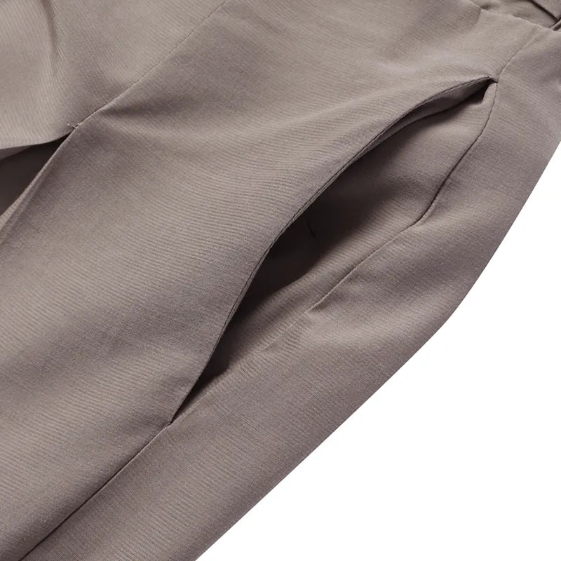 Plus-size woman walking, showing flow & drape of elegant wide-leg palazzo pants.
