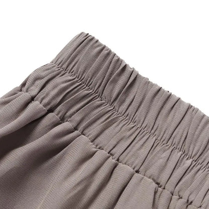 Assortment of plus-size wide-leg work pants in various colors for chic office fashion.