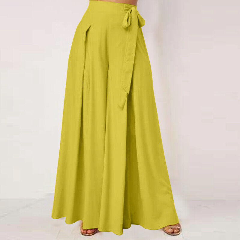 Plus-size woman modeling chic wide-leg work pants, showcasing a professional look.