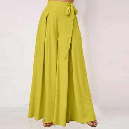 Plus-size woman modeling chic wide-leg work pants, showcasing a professional look.