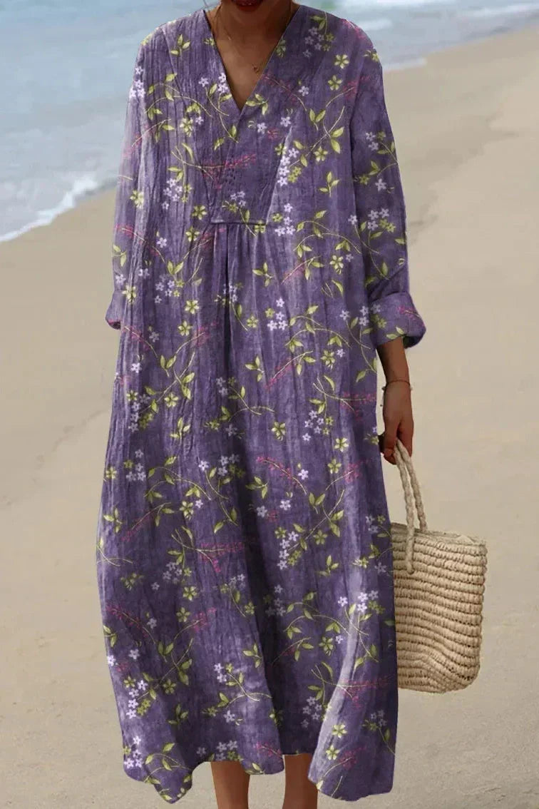 Elegant purple floral V-neck midi dress for women, with long sleeves. Perfect for spring & summer comfort.