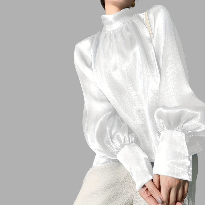 Chic women's puff sleeve top, an elegant blouse suitable for workwear or stylish casual outfits.