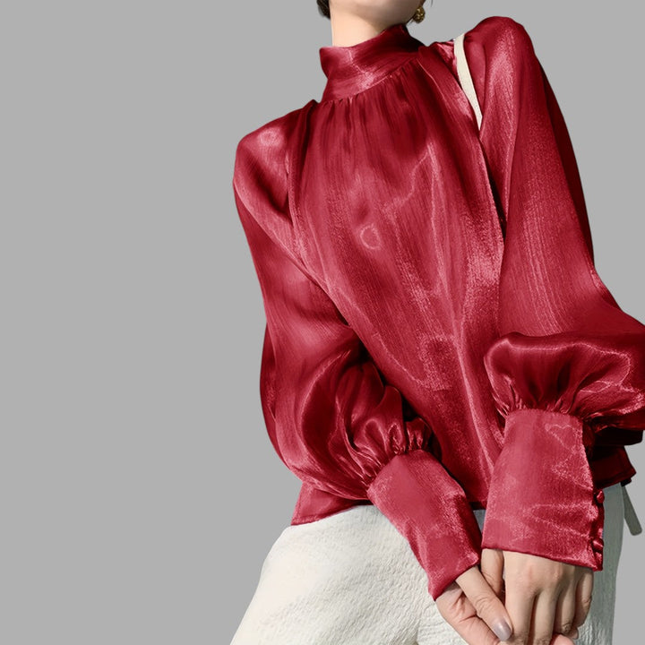 Trendy women's puff sleeve top in silver, an elegant blouse for modern fashion and versatile wear.