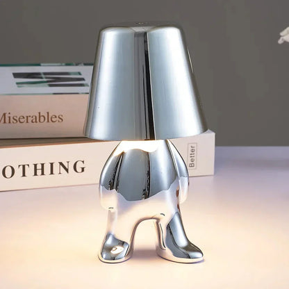 Portable LED table lamp, rechargeable for flexible home lighting and atmospheric ambiance.