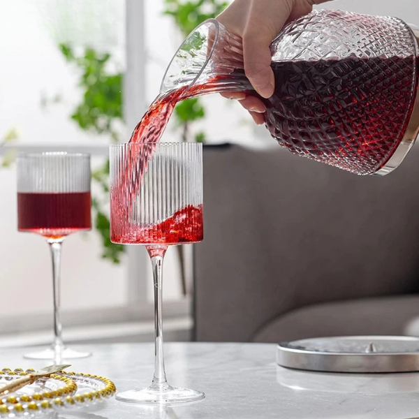 Modern ribbed drinking glass, adding sophistication to any table setting.