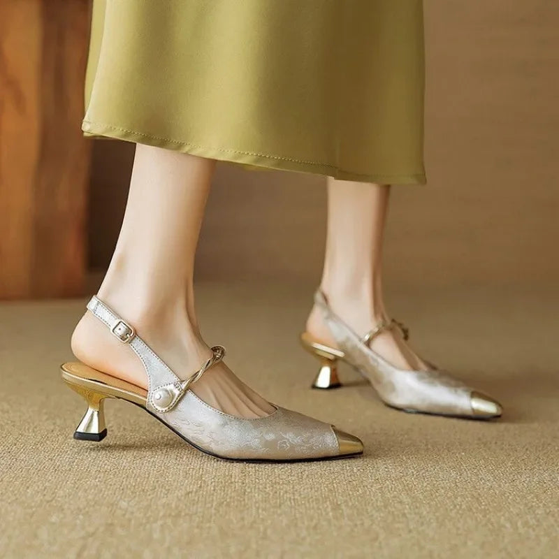 Woman wearing sophisticated Savana low heel kitten heels; elegant dress shoes ideal for evening or party wear.