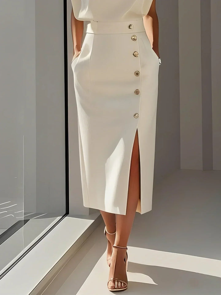 Side profile: women's tailored sleeveless midi dress, emphasizing the graceful side slit & gold button.