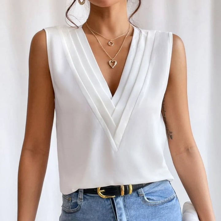 Stylish women's sleeveless V-neck top. An oversized chic blouse, ideal for spring & summer fashion. Versatile.