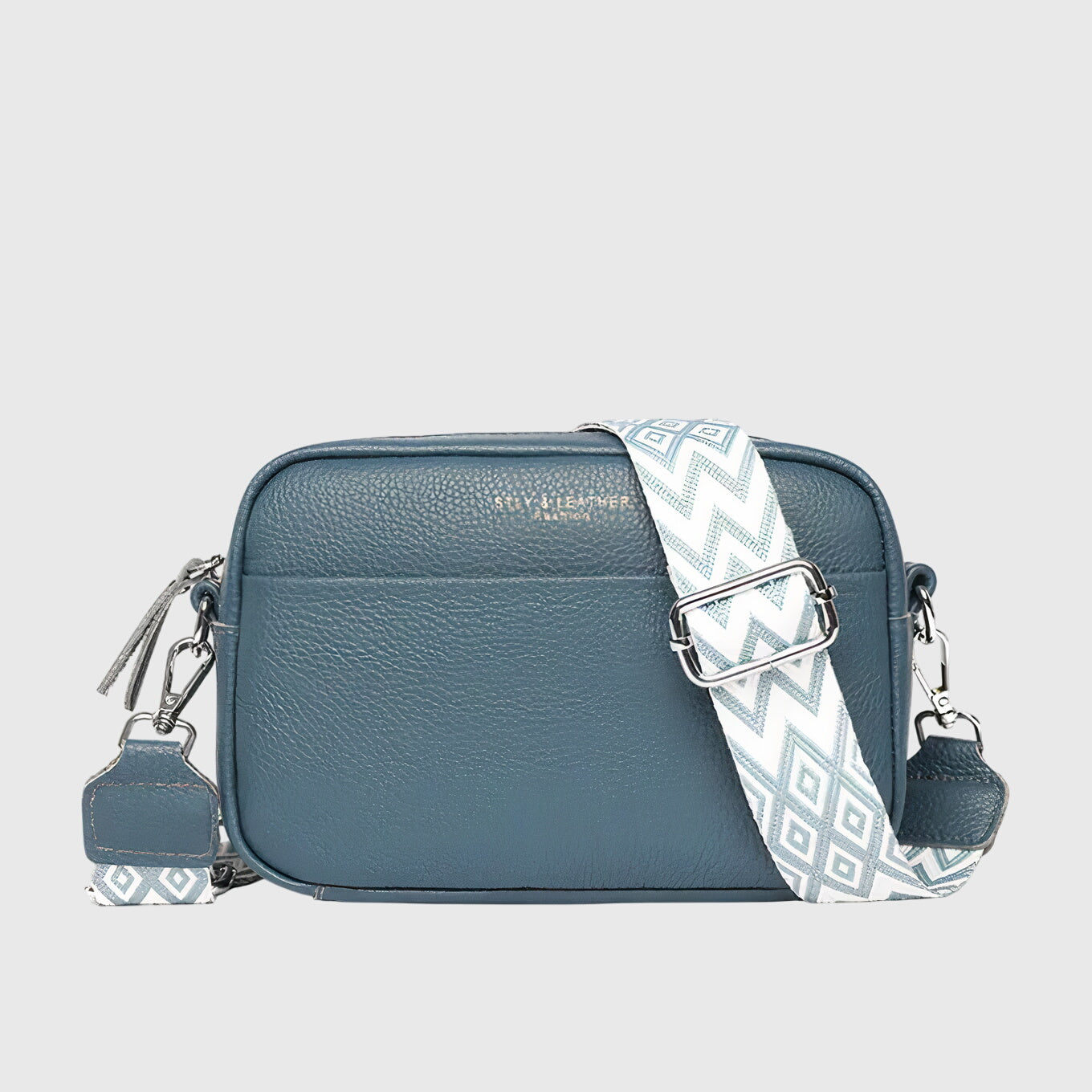 Chic synthetic leather shoulder bag for women, featuring an adjustable strap for versatile style.