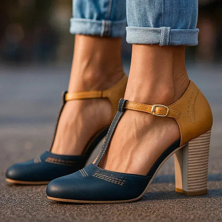 Stylish women's two-tone block heel pumps, offering elegance and comfort for office or dressy occasions.