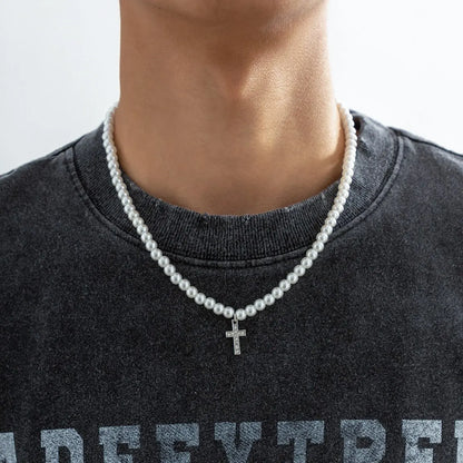 Elegant unisex pearl necklace with a delicate cross pendant, perfect for minimalist religious jewelry and fashion.