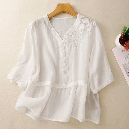 Relaxed fit women's V-neck blouse, elegant button-front design, suitable for casual chic or professional office wear.