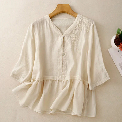 Women's long sleeve V-neck blouse, elegant button-front detailing, versatile for stylish everyday fashion.