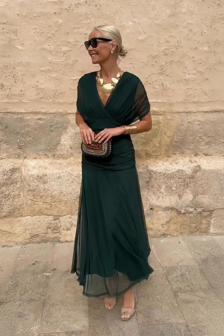 Elegant V-neck maxi dress for women with pleated waist, ideal wedding guest or formal evening attire.