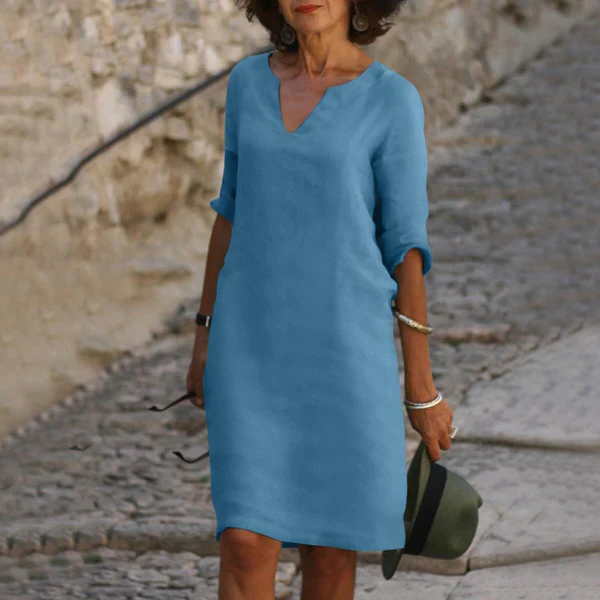 Elegant V-neck three-quarter sleeve flowy midi dress for women, perfect for spring & summer fashion.