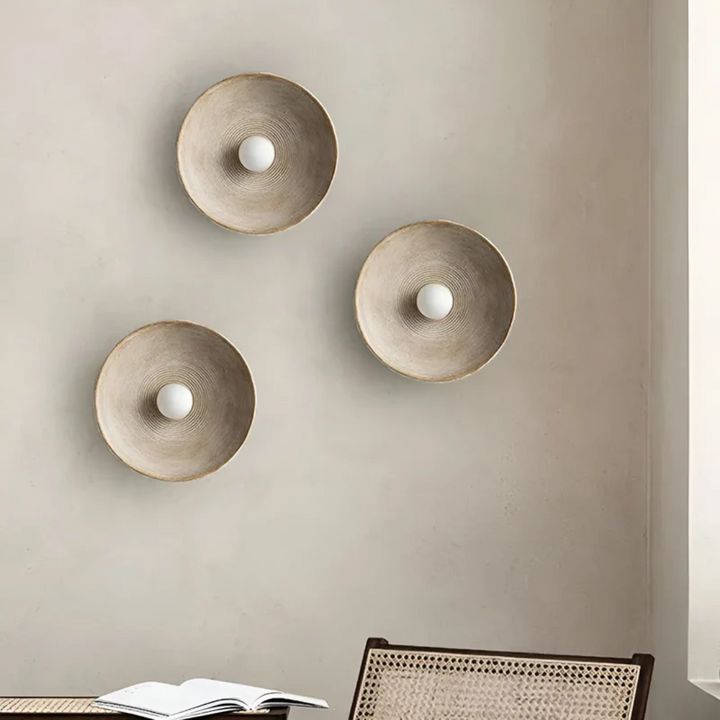 Modern Wabi-Sabi disc wall lamp, artistic design for soft, ambient Japanese lighting in bedrooms.