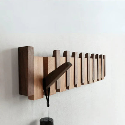 Elegant wall mounted wooden piano coat rack with 8 hooks for stylish entryway organization.