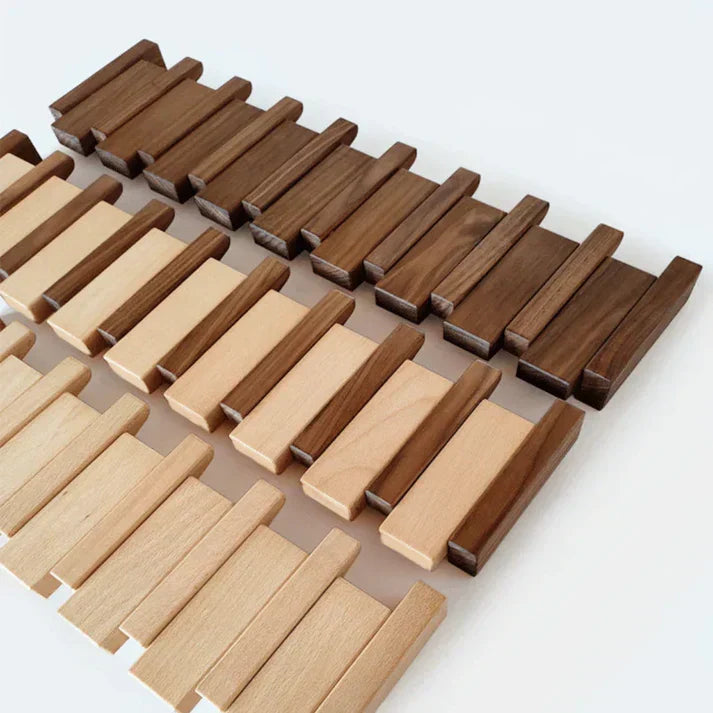 Decorative wooden piano coat rack with retractable 'keys' acting as hooks for coats & hats.