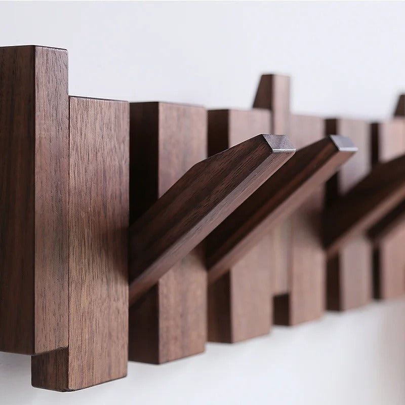 Minimalist wooden piano coat rack, wall mounted, offers smart storage for coats, hats & bags.