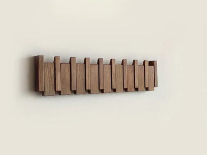 Versatile wood piano coat rack. Wall-mounted hooks for coats, hats, scarves in any living space.