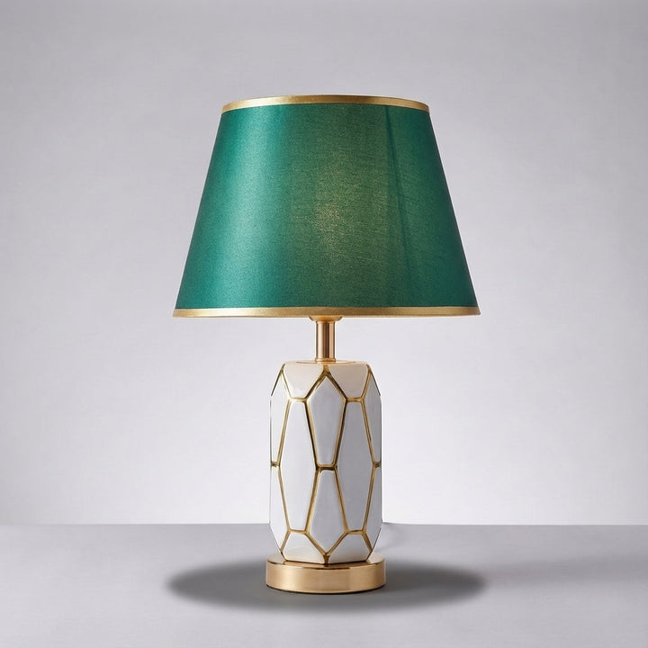 Stylish ceramic table lamp with a decorative fabric shade, providing a soft, inviting glow for any room.