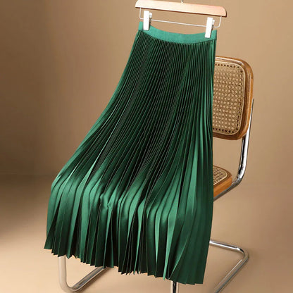 Women's silver elegant flowy pleated midi skirt, a chic and versatile fashion essential for effortless style.