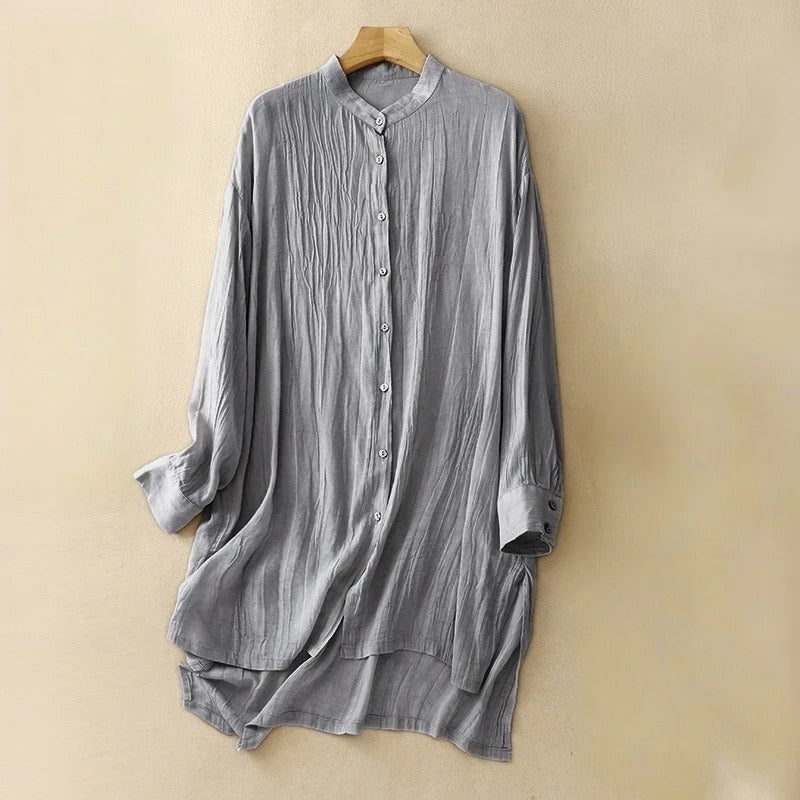Blue flowy midi dress for women featuring a chic mandarin collar and short sleeves. Ideal elegant summer casual fashion.