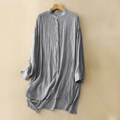 Blue flowy midi dress for women featuring a chic mandarin collar and short sleeves. Ideal elegant summer casual fashion.