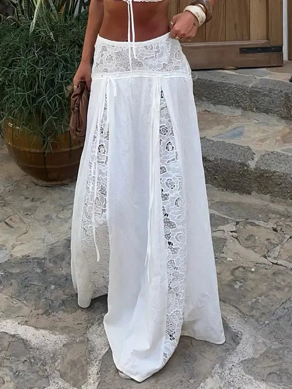 Flowing white women's maxi skirt featuring intricate lace panel details, an elegant choice for summer fashion.