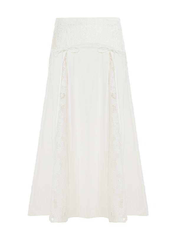 Women's elegant white lace maxi skirt, a flowing design perfect for summer fashion, from day to night.