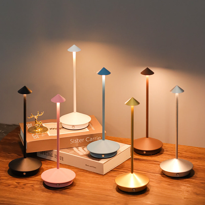 Elegant wireless LED table lamp, dimmable & portable for indoor/outdoor modern lighting and decor.