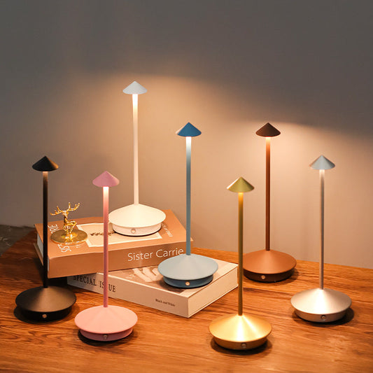 Elegant wireless LED table lamp, dimmable & portable for indoor/outdoor modern lighting and decor.