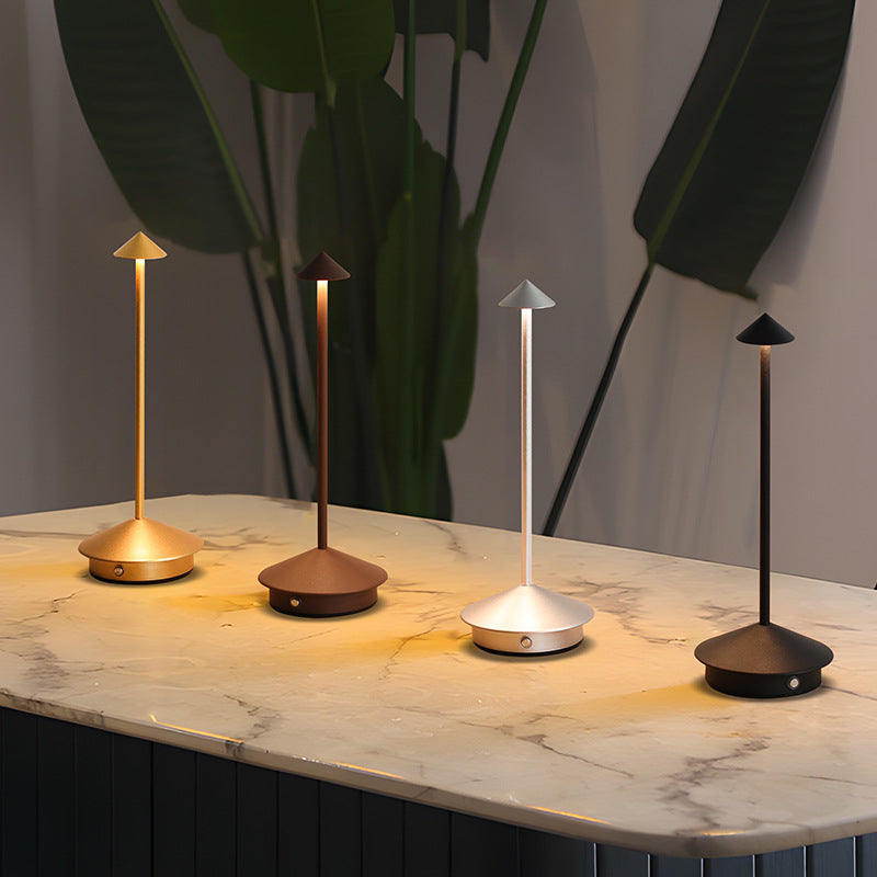 Minimalist rechargeable LED touch lamp. Dimmable, portable ambient light for home, office, and patio.
