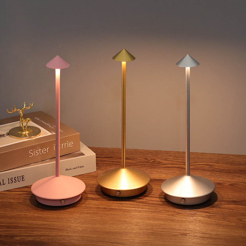 Modern wireless table lamp. Portable & dimmable LED light perfect for bedroom, living room, and outdoor decor.