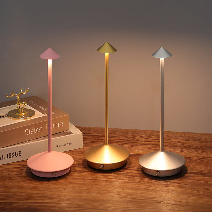 Modern wireless table lamp. Portable & dimmable LED light perfect for bedroom, living room, and outdoor decor.
