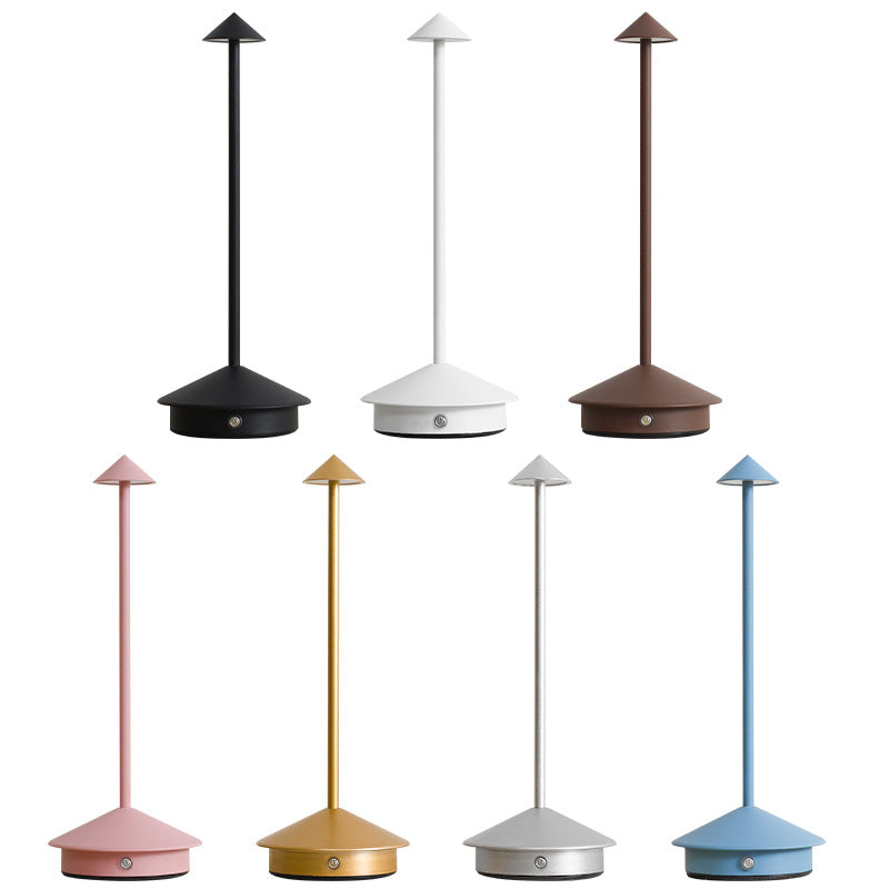 Portable wireless LED table lamp. Dimmable, rechargeable, and touch-sensitive for convenient indoor/outdoor use.