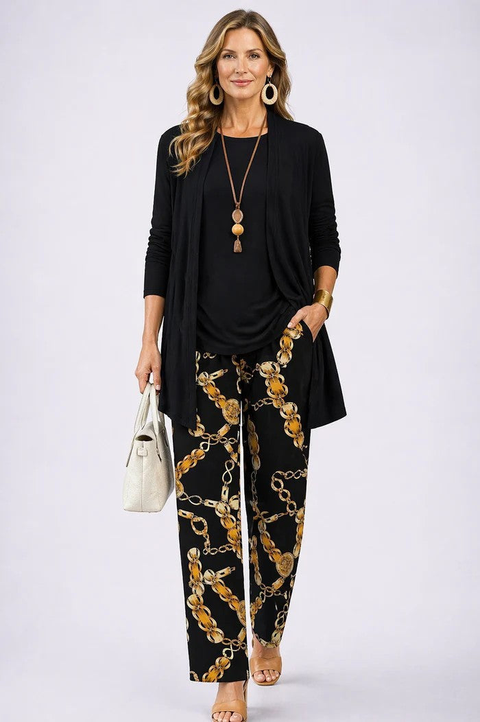 Detailed view of the women's elegant 3-piece blazer & trousers. Coordinated fashion set.