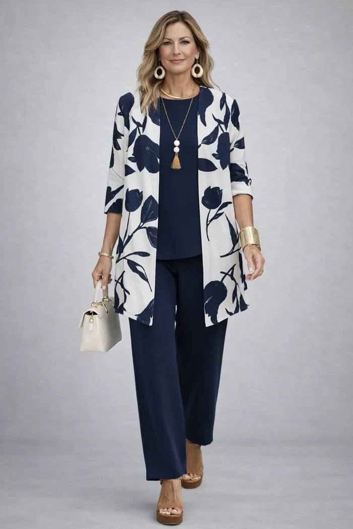 Model wearing a stylish women's 3-piece blazer, top & trousers set. Perfect for business chic fashion.