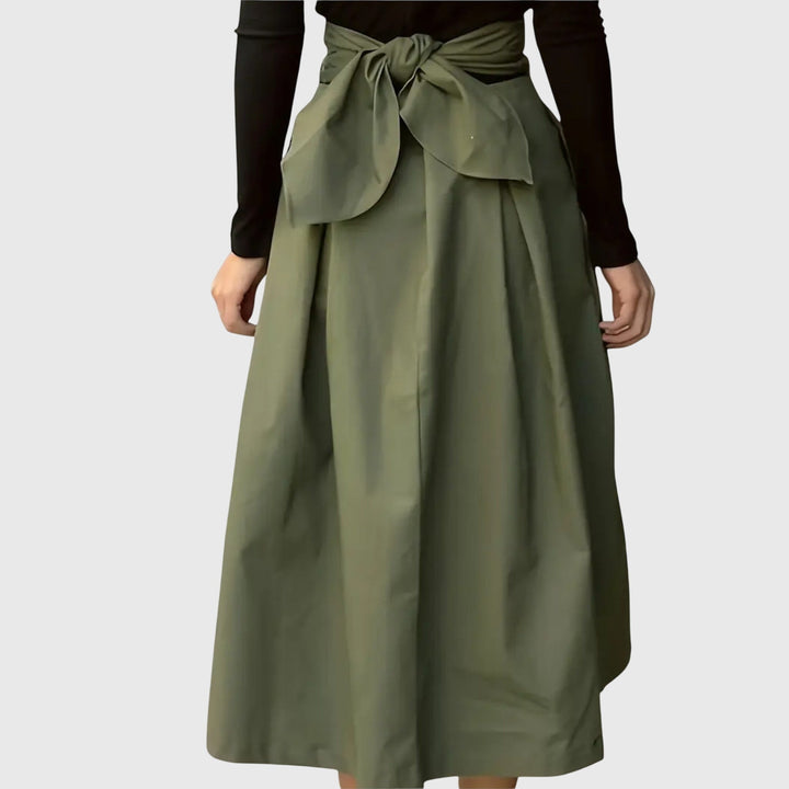 Stylish women's green midi A-line skirt, an elegant and comfortable choice for sophisticated office wear.