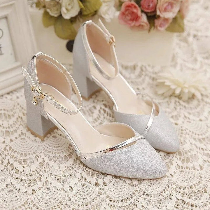 Versatile women's block heel pumps with supportive ankle strap, offering comfort for all-day wear.
