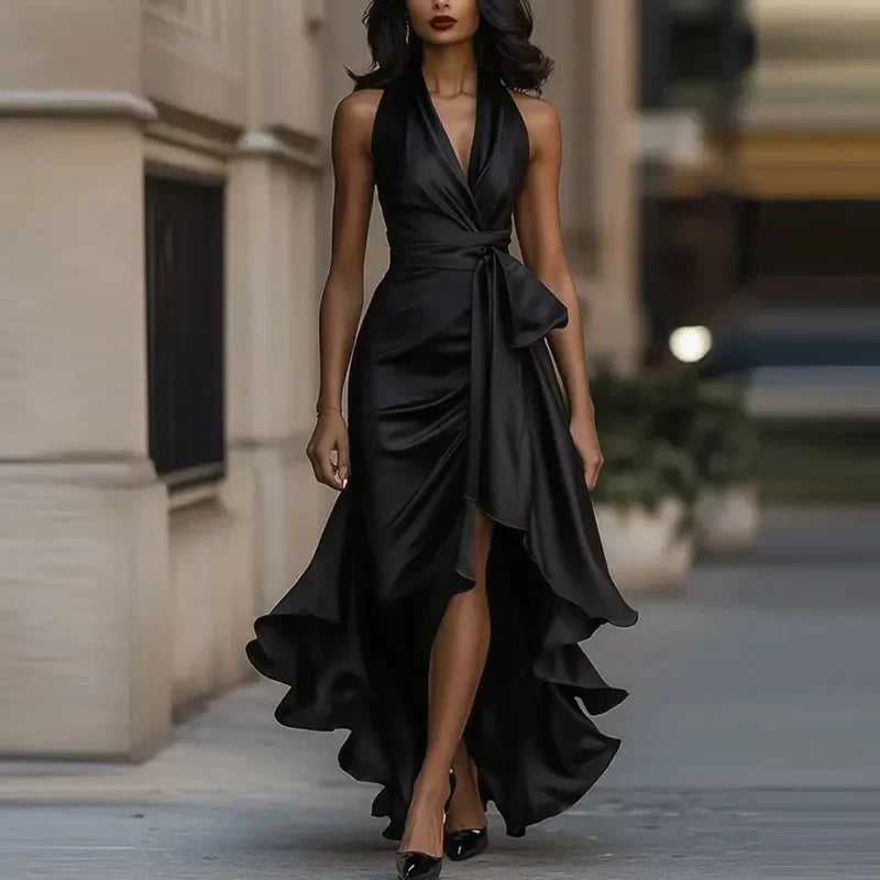 Women's long V-neck off-shoulder evening gown with elegant asymmetrical design and flowing silhouette.
