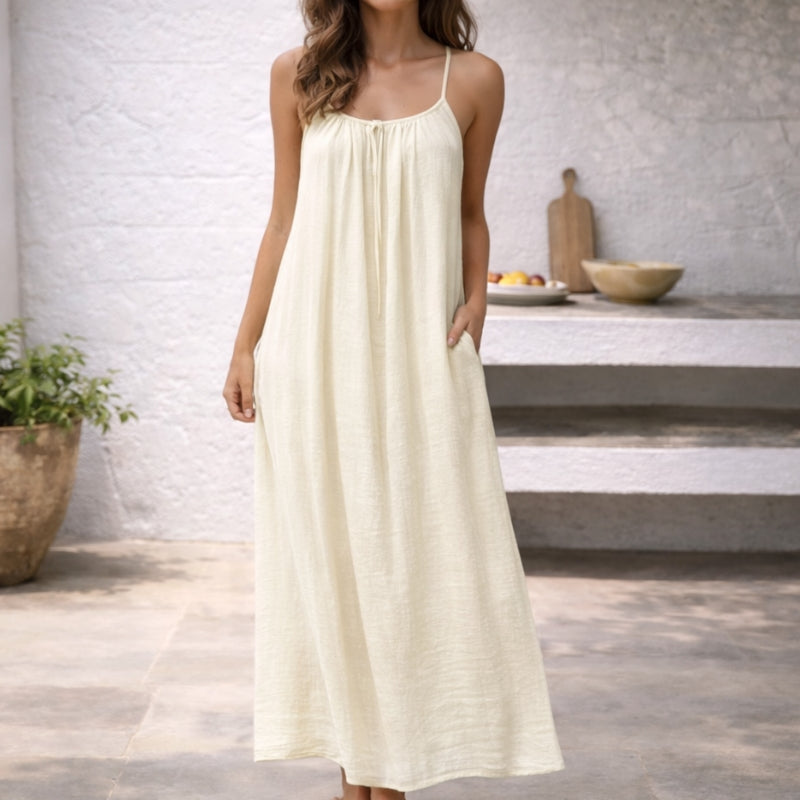 Sleek women's backless cami dress, a modern elegant design for parties, evening, or summer casual.