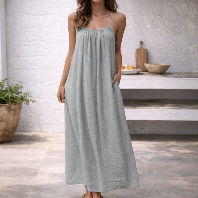 Flowy and feminine backless cami dress for women, elegant and comfortable for summer evenings.